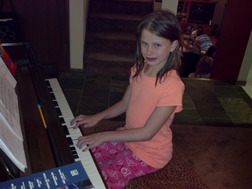 Delaney plays piano